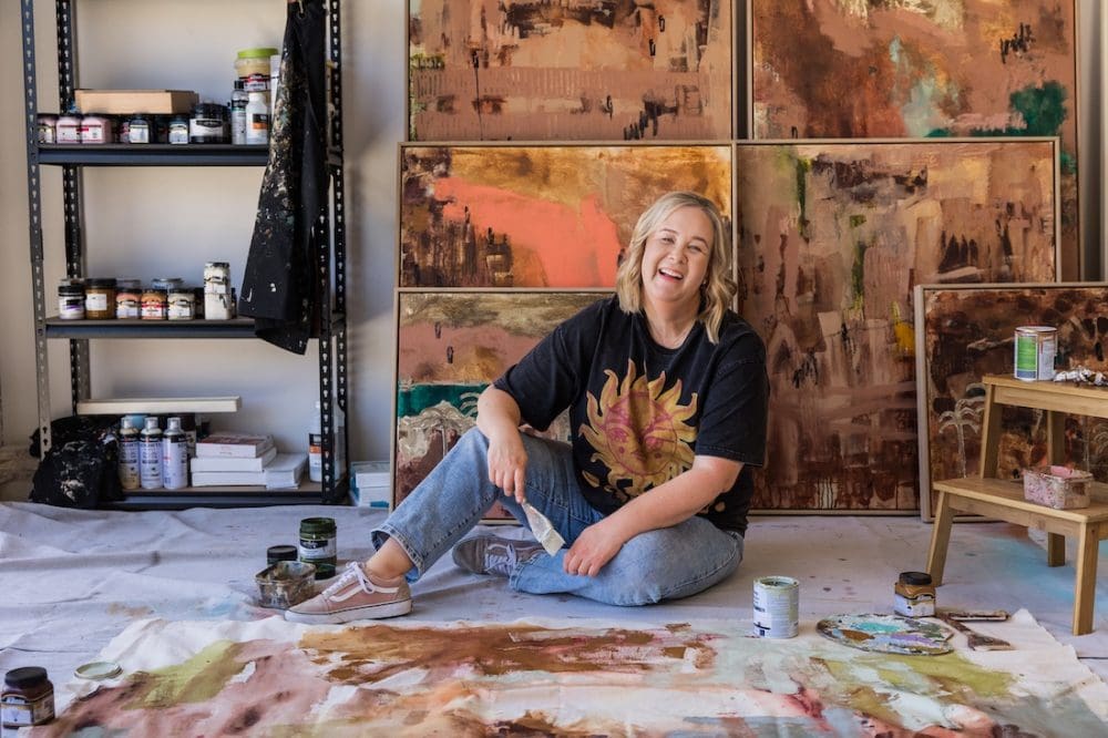 Bec Talbot on floor of studio