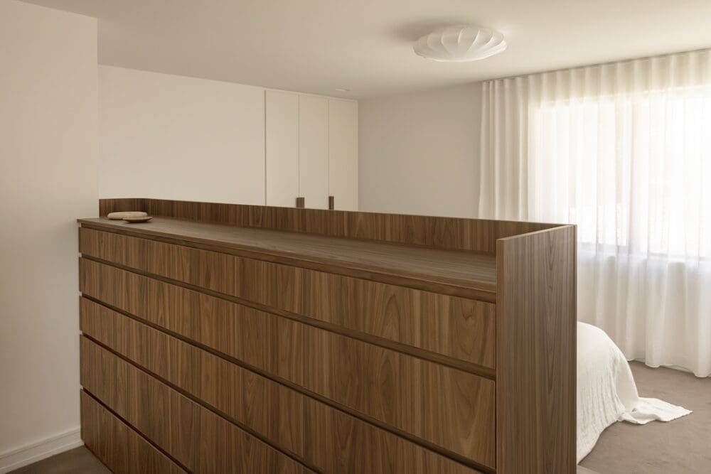 Custom joinery walk in closet come bedhead in Deakin Home