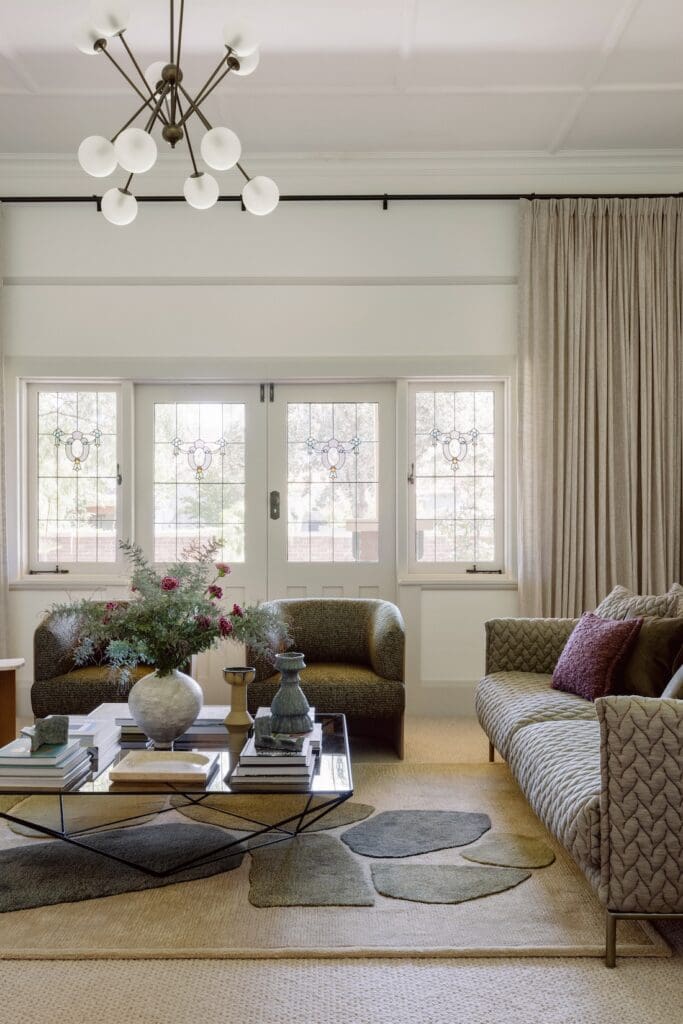 Sheer pinch pleat curtains on black curtain track