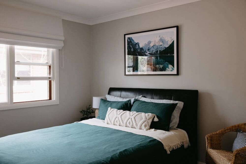 Guest bedroom with teal bedding