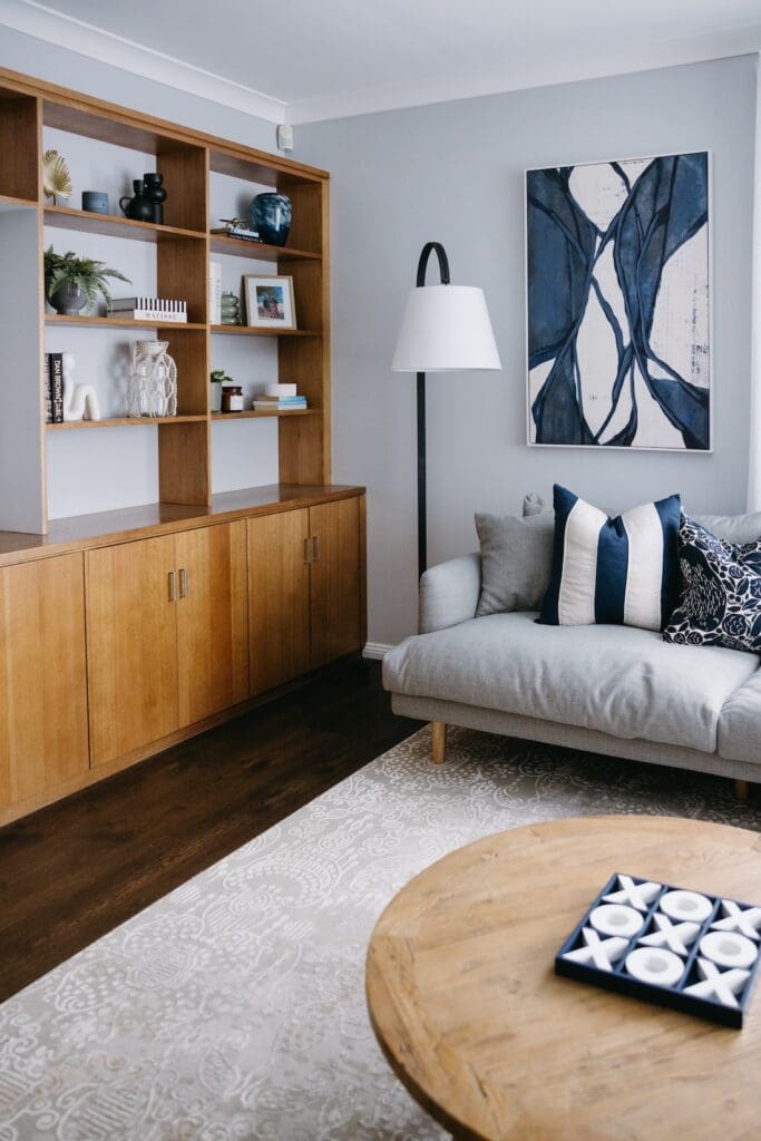 Navy blue accents in coastal living room