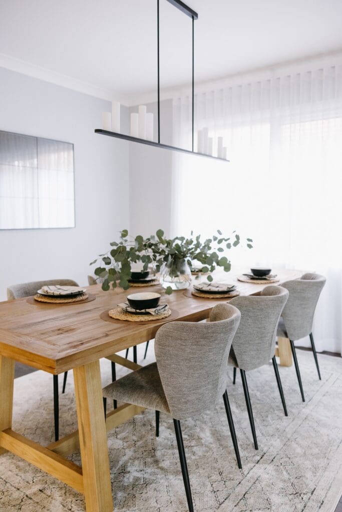 Dining room with timber table and upholstered dining chairs