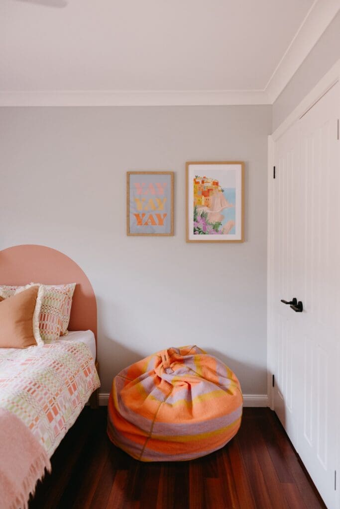 Cool colourful striped bean bag in girls room