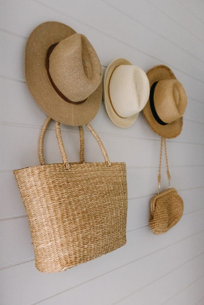 Straw hats hanging in entryway