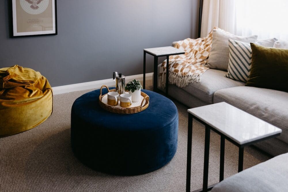 Blue velvet ottoman in living room