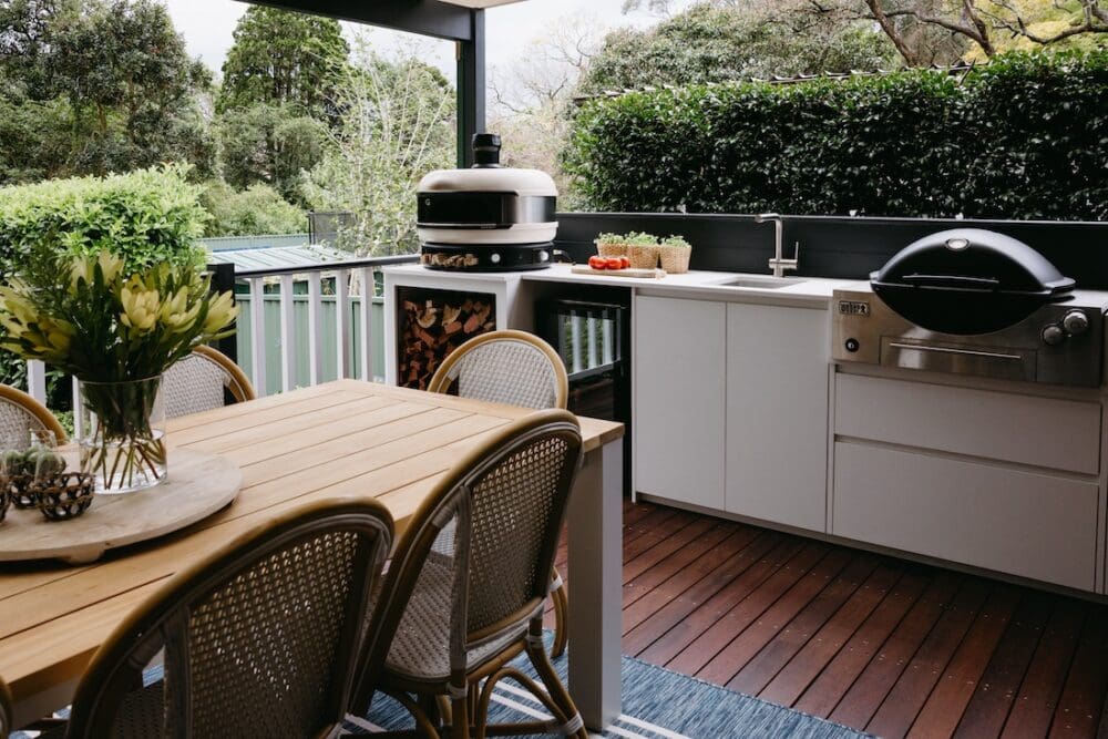 Luxury outdoor kitchen with pizza oven, built in fridge and BBQ