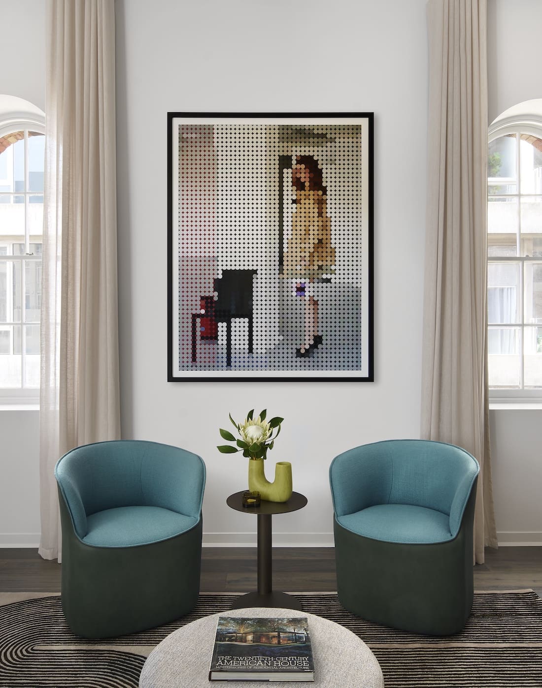 Teal occasional chairs in living room of Tribeca Brewery apartment by The Stylesmiths
