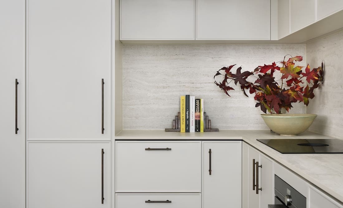 White kitchen cabinetry in Tribeca Brewery apartment by The Stylesmiths