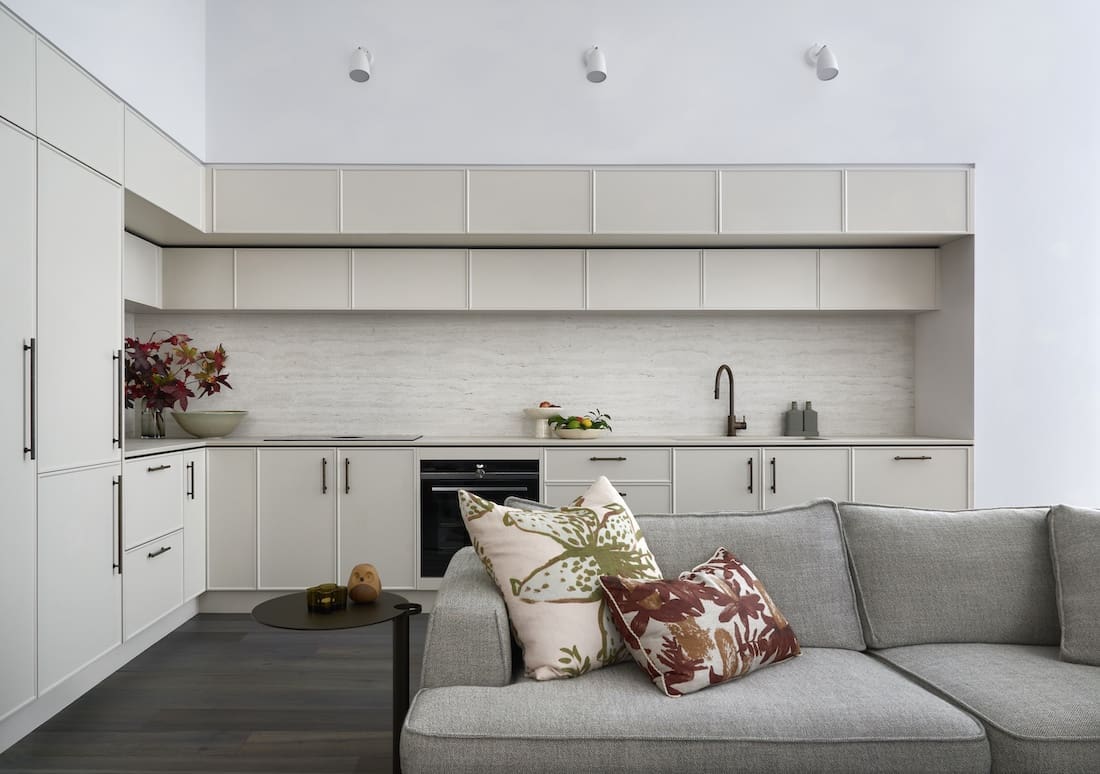 Kitchen and living space inside Tribeca Brewery apartment by The Stylesmiths