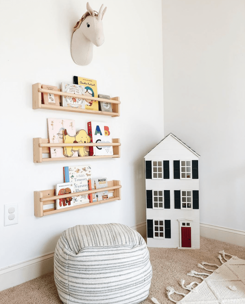 Timber bookshelves in kids reading nook