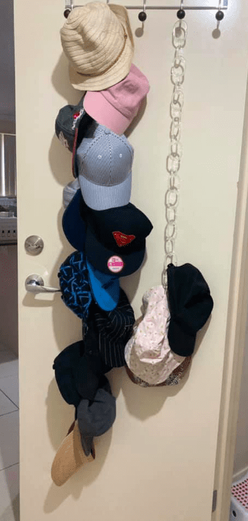 Hats organised with shower curtain hooks