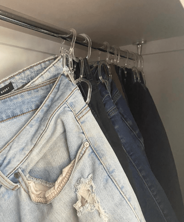 Jeans organised with shower curtain rings