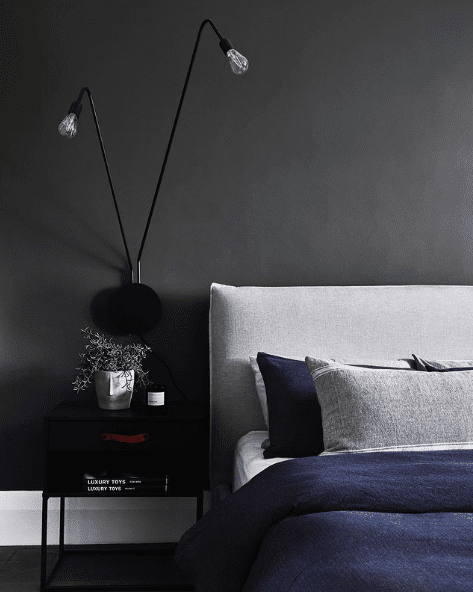 Black wall in teen boy bedroom
